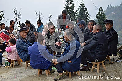 GUIZHOU PROVINCE, CHINA â€“ CIRCA DECEMBER 2017: A group of people different ethnic minority on the occasion of weddin Editorial Stock Photo